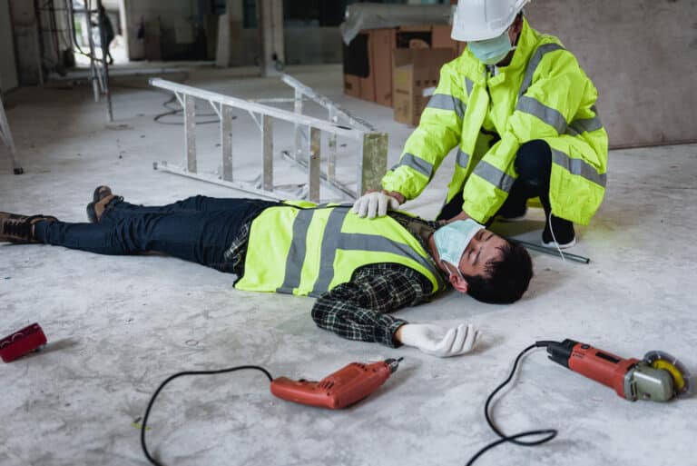 Work accidents of worker in the workplace at construction site area, Builder accident falls ladder on floor and Unconscious, Electric suction, Unsafe concept.